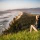 Girl looking at the coastline landscape