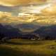 Golden landscape with clouds and hills