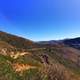 Hills landscape under blue sky