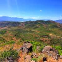 Hills landscape with large rocks in the foreground