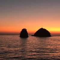 Islands sticking out of the water at Sunset