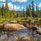 Lake, water, rocks, and trees landscape