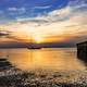 Landscape of sunset near the shore with boat