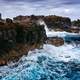 Large Waves crashing on rocky shoreline