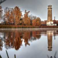 Lighthouse and reflections on the lake