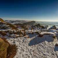 Mountain peak with sun and town