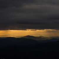 Mountains at dusk under the clouds