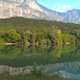 Nature landscape with trees, river, and mountains