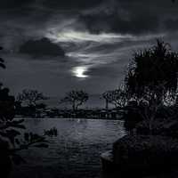 Night time landscape view with clouds and moon