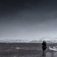 Photographer standing in the landscape of the Mountains