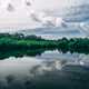 Pond and lake landscape with heavy clouds in the sky