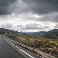 Road and landscape under clouds in the Andes