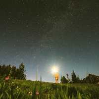 Sky with Stars with guy holding a light