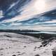 Snow covered Mountaintop Landscape and sky