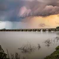 Storm clouds over the dusk lake landscape