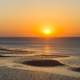 Sunset and orange sky over the ocean