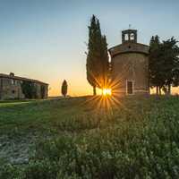 Sunset behind a tower in the landscape