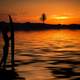 Sunset on the beach with surfer girl