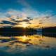 Sunset over the lake with sky and clouds