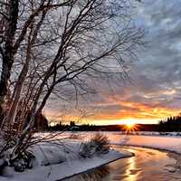 Sunset over the winter landscape with clouds