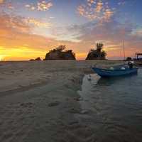 Sunset, shoreline landscape with boats