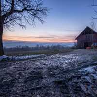 Winter landscape with small house