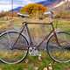 Bicycle parked by the barbed wire