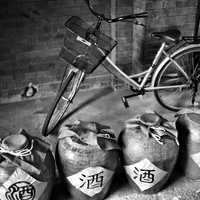 Bike with jugs of wine black and white