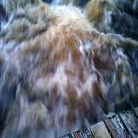 Cascading water from the top of a bridge