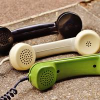 Green, black, and white phones