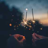 Hands lighting Sparkler Fireworks