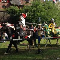 Knight riding on horse at medieval festival