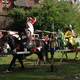 Knight riding on horse at medieval festival