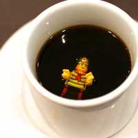 Legoman drowning in a cup of coffee