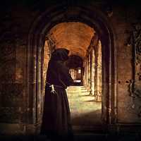 Monk standing in the doorway of a Monastery