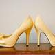 Pair of Golden Shoes with high heels