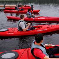 People in Red Canoes paddling