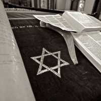 Star of David next to Jewish Torah Scripture