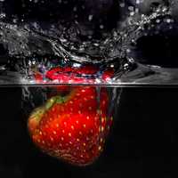Strawberry Plunging into Water