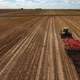 Truck plowing the fields