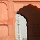 Minar-e-Pakistan richly framed by an aisle arch in Lahore