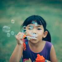 Asian little girl happy with water bubble