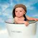 Baby in a laundry bucket
