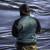 back-of-fisherman-in-a-hoodie