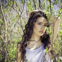 beautiful-lady-in-a-white-shirt-among-green-shirt