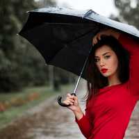 beautiful-woman-in-red-shirt-and-umbrella-in-the-rain