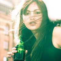 beautiful-woman-with-wind-swept-hair-a-drink