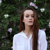 Beautiful Young Woman in white shirt with long hair