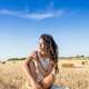 beautiful-young-women-sitting-in-field