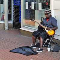 black-man-playing-guitar-on-the-street